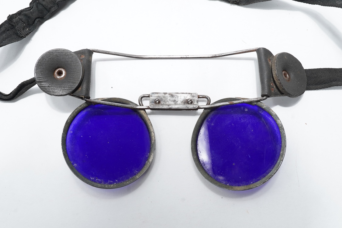 A pair of WW2 ARP fire fighter’s blue tinted goggles, stamped GR below a crown, probably by Fleming London